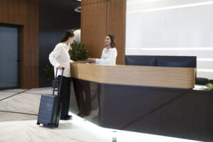 woman-talking-with-hotel-receptionist-lobby